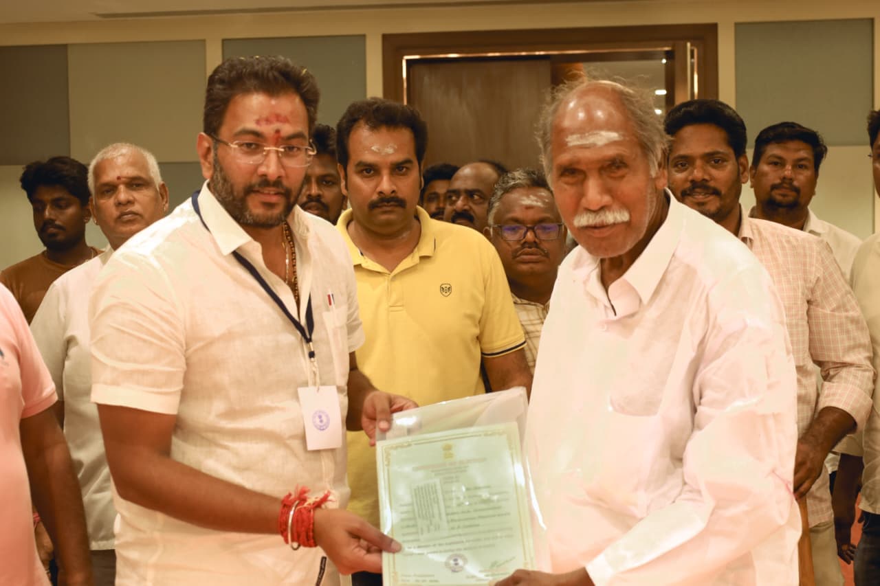 Dr. K. Narayanasamy receiving the certificate of election